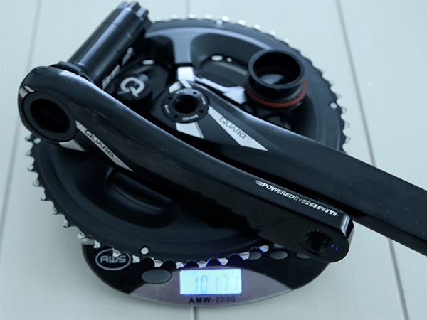 complete crankset on scale. 1017.1 grams showing on scale reading.